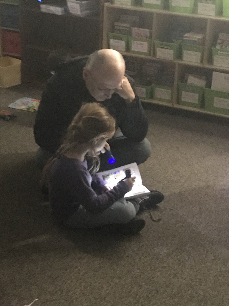 Reading with her Papa. 